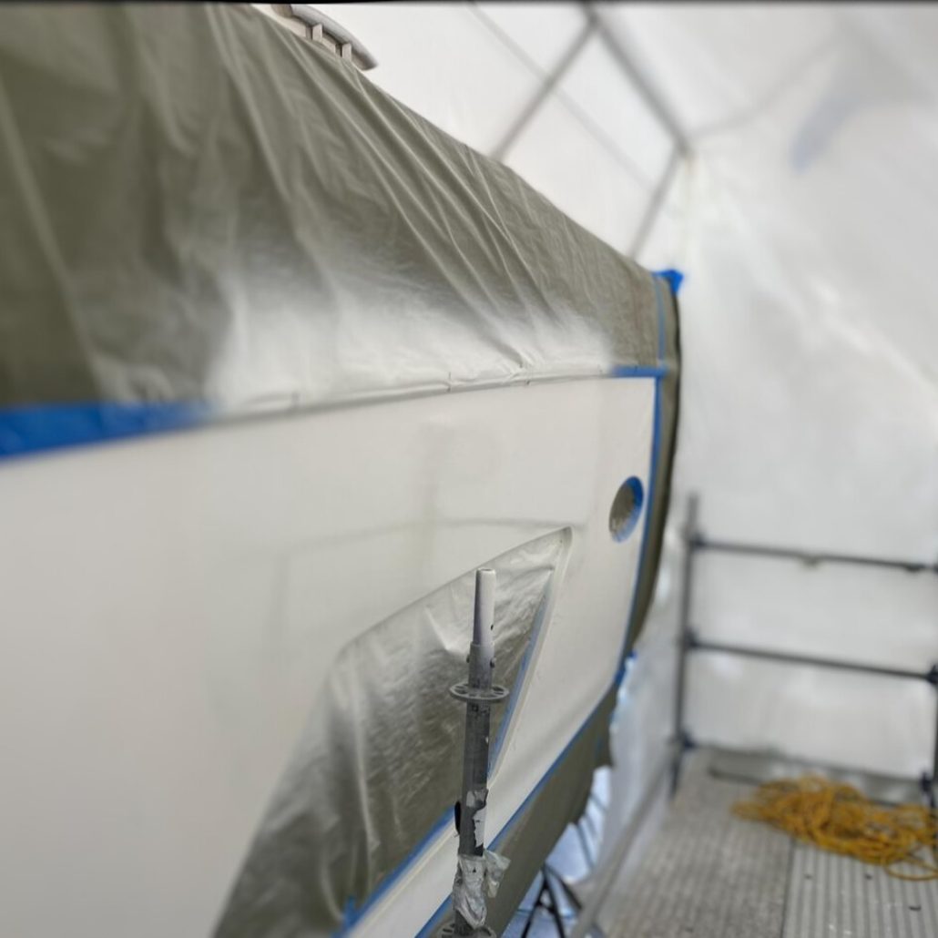 Princess 62-foot hull side masked during refinishing