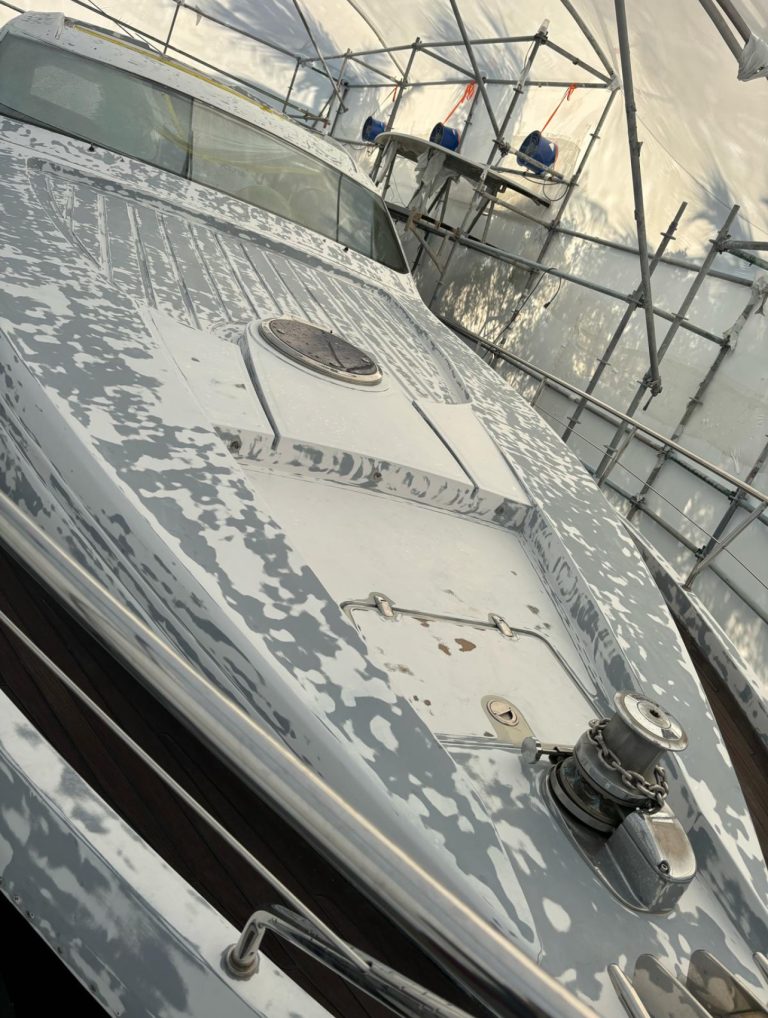 Pershing 64 foredeck and superstructure with sanded surfaces during preparation