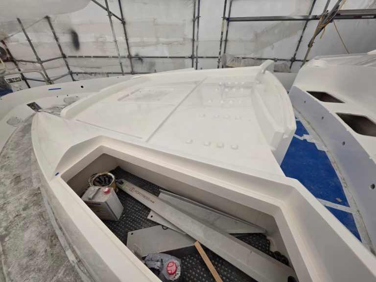 Sunseeker 74 white painted foredeck contours and open fittings inside the enclosure