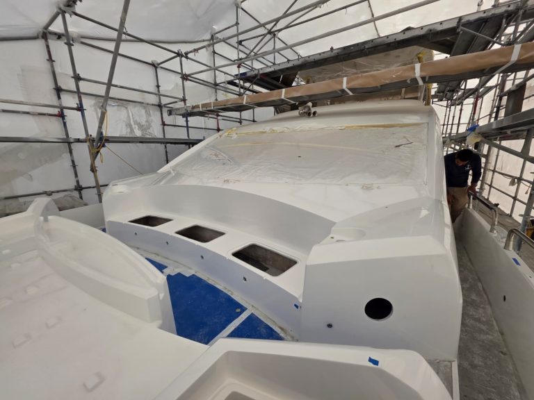 Sunseeker 74 white Awlgrip superstructure finish with windscreen masking inside the enclosure