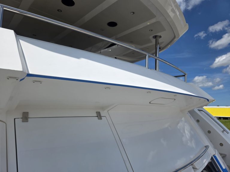 White Sunseeker stern and balcony surfaces with blue masking tape along the edge