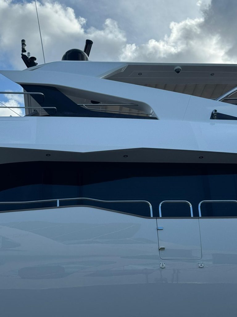 Sunseeker upper exterior showing white surfaces, dark glazing and reflected surroundings