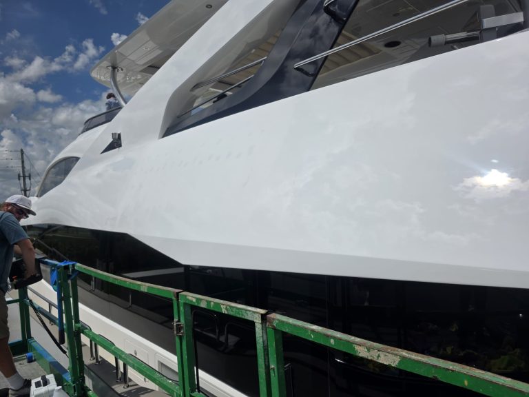 Reflections along the white Sunseeker exterior above the dark side glazing
