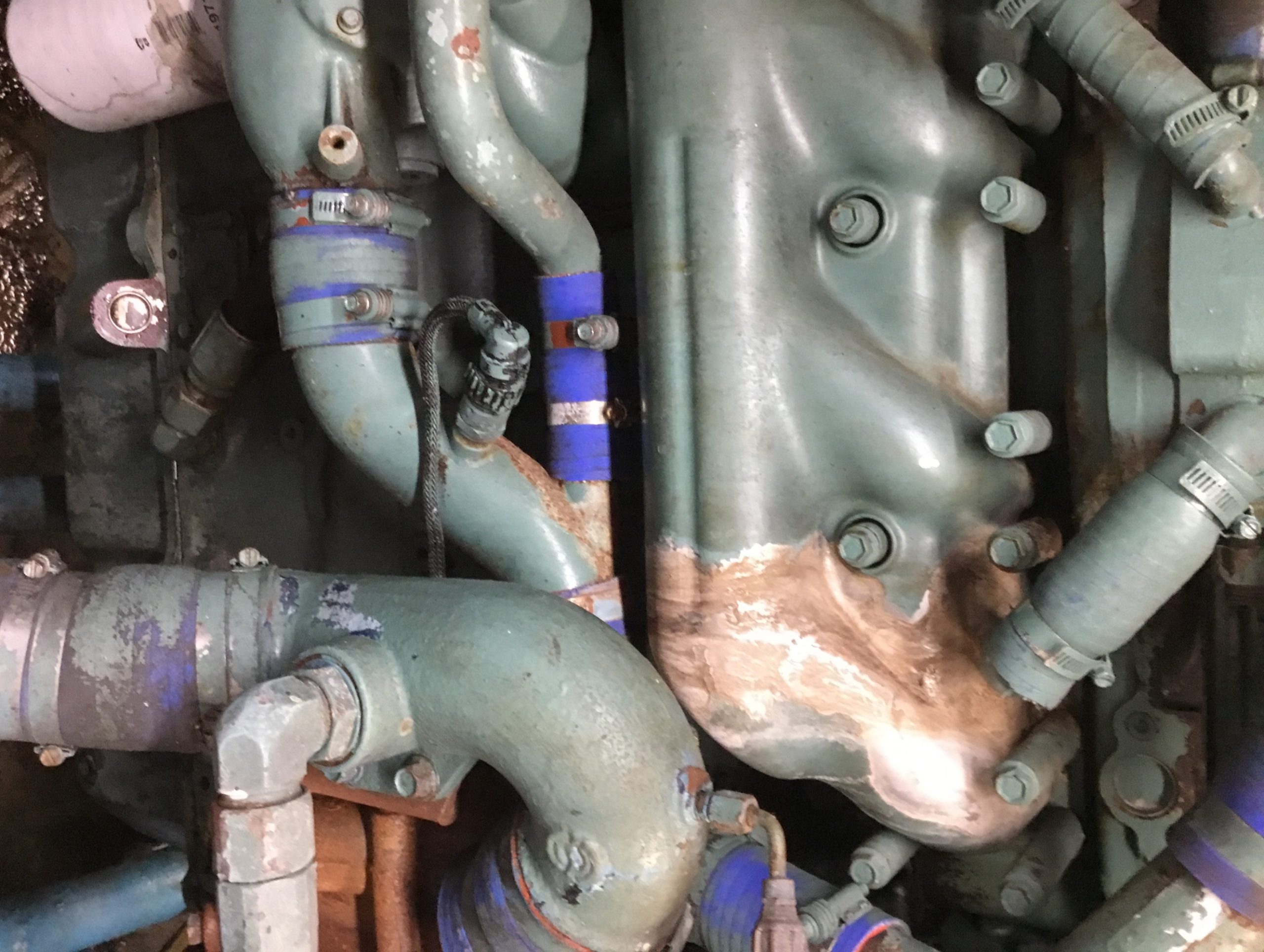 Marine diesel inboard cooling and exhaust components documented during inspection