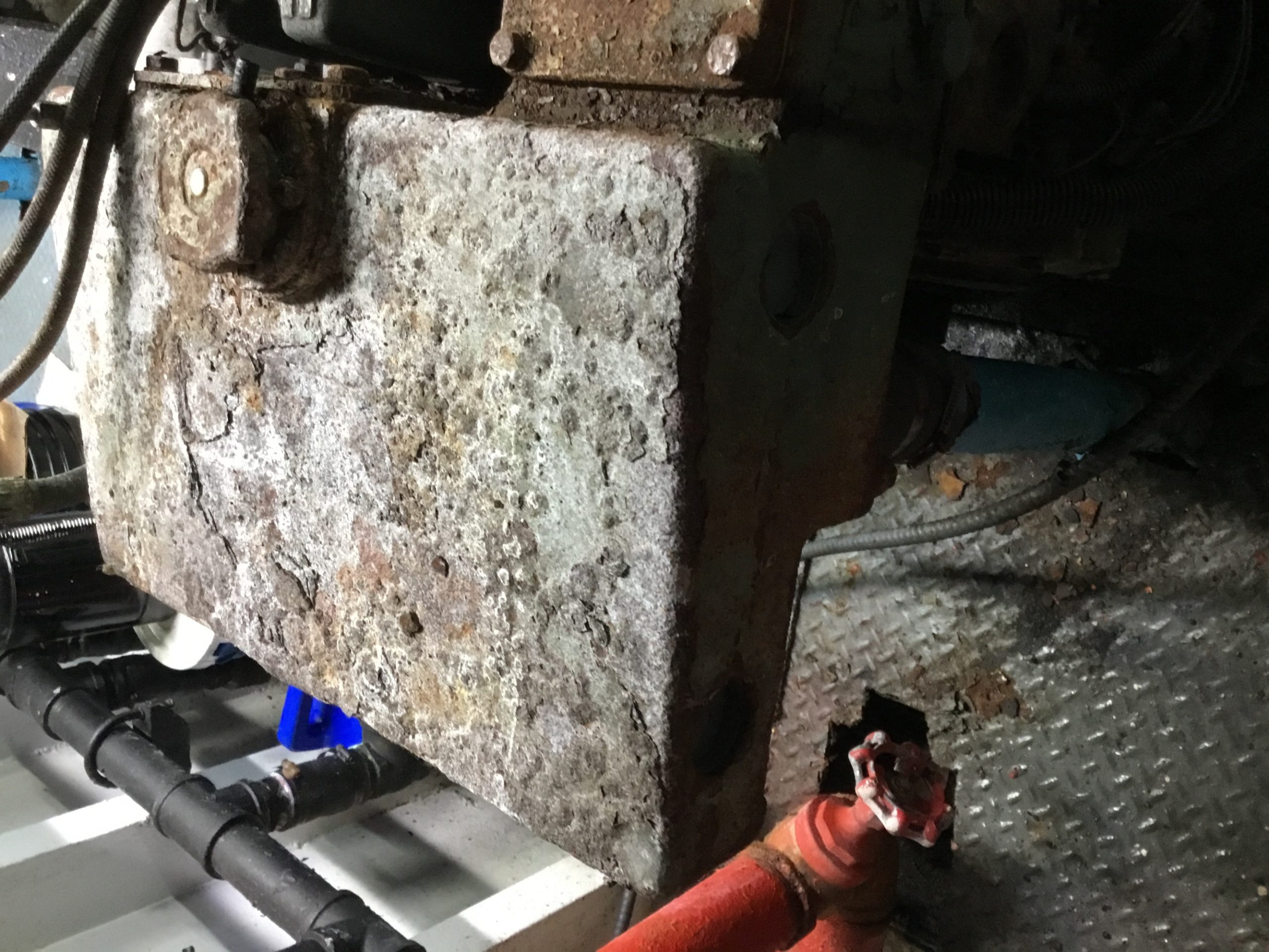 Severely corroded marine generator cooling reservoir documented during inspection